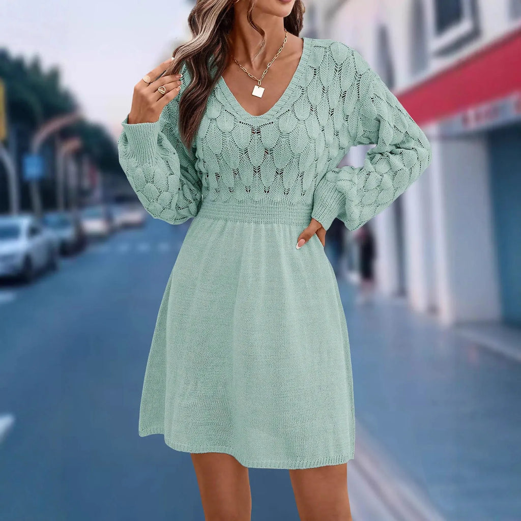 Women's apricot V-neck dress with long sleeves, high waist and a textured 3D pattern detail.