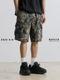 Men's loose fit straight-leg denim shorts in army green on a plain background.