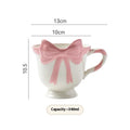 Ceramic mug with girl heart bow decoration in white powder or black pink colour, 301-400ml capacity.