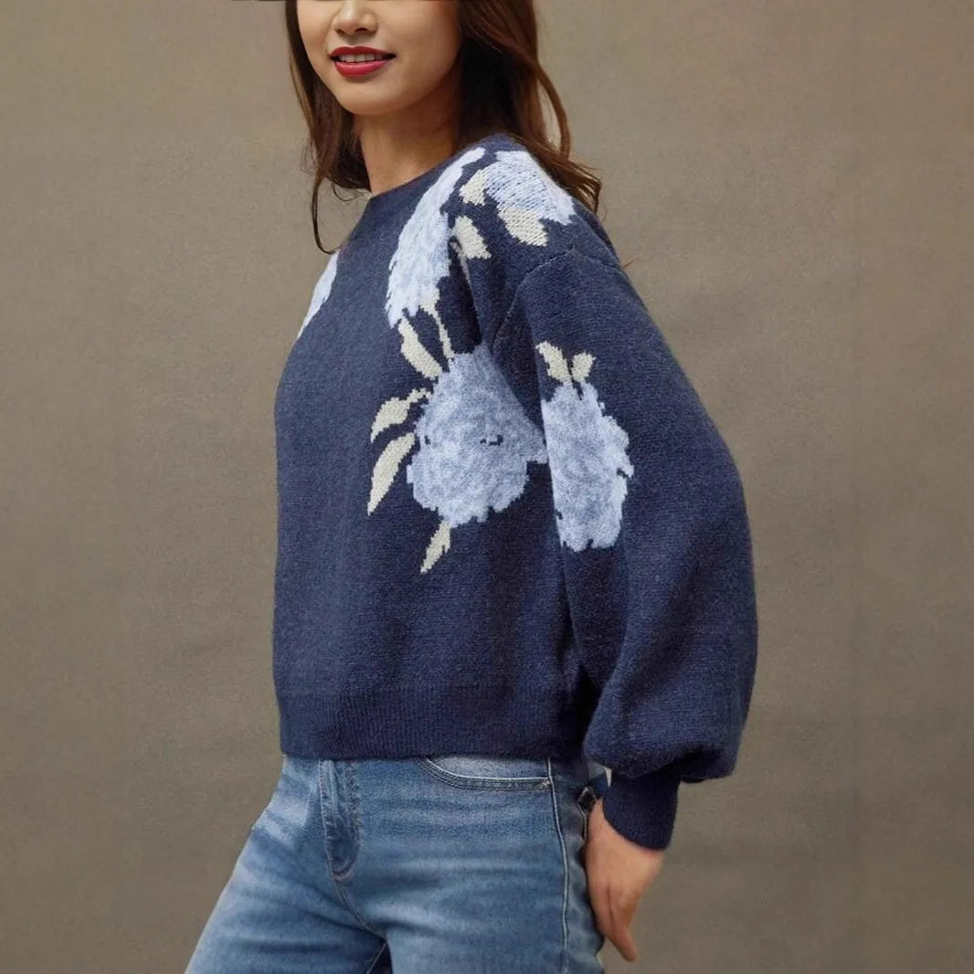 Women's loose-fit sapphire blue pullover with white flower jacquard pattern and long sleeves.