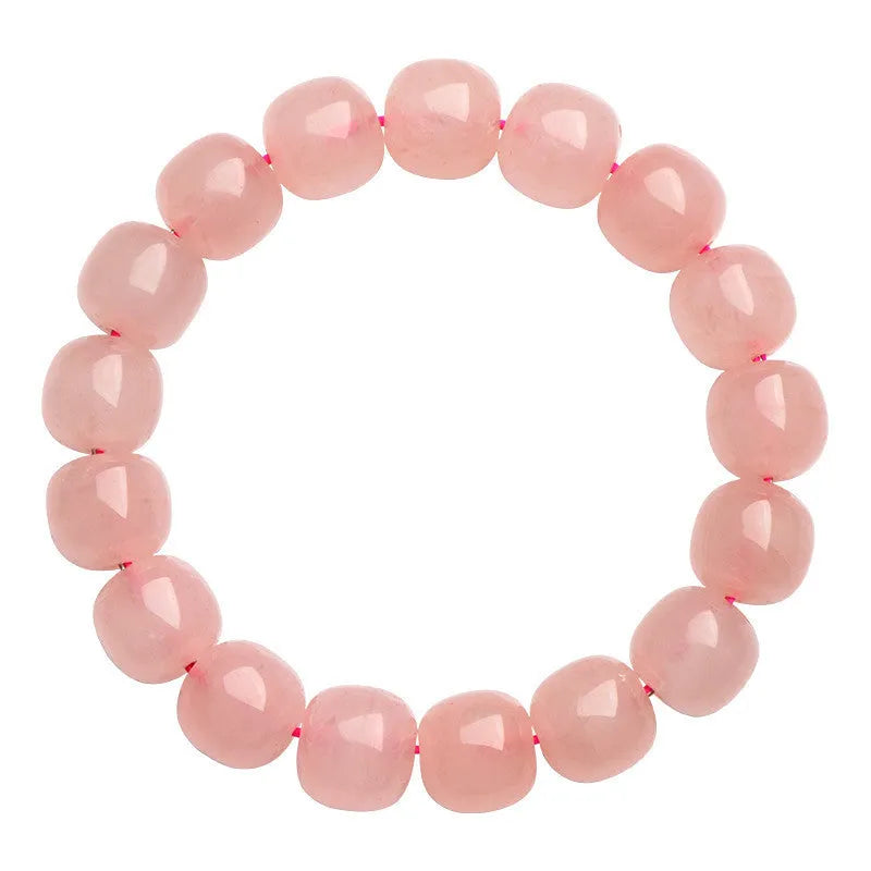 Pink crystal barrel bead bracelet with geometric design and polished finish
