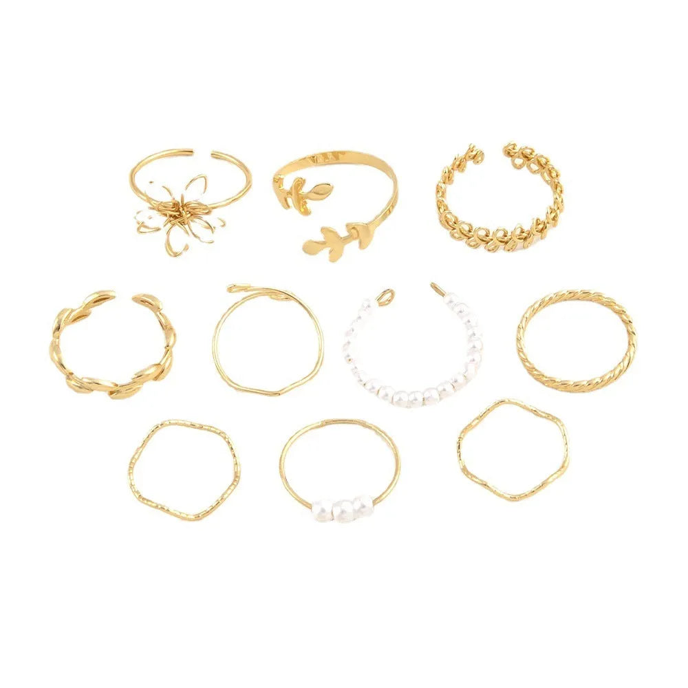 Gold-tone openwork floral ring with a glossy electroplated finish on an alloy band.