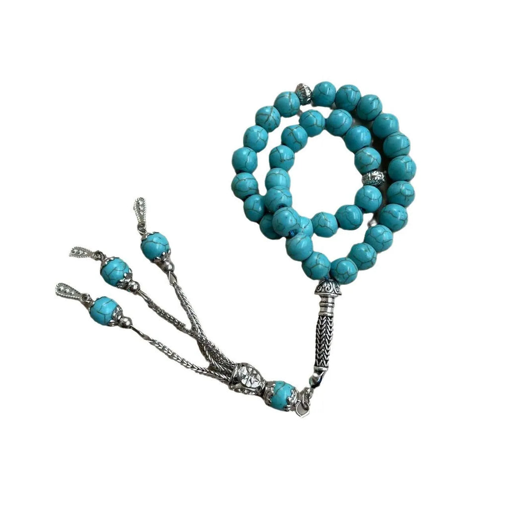 Handmade sky blue stone Muslim prayer bracelet with 8mm beads on wrist.