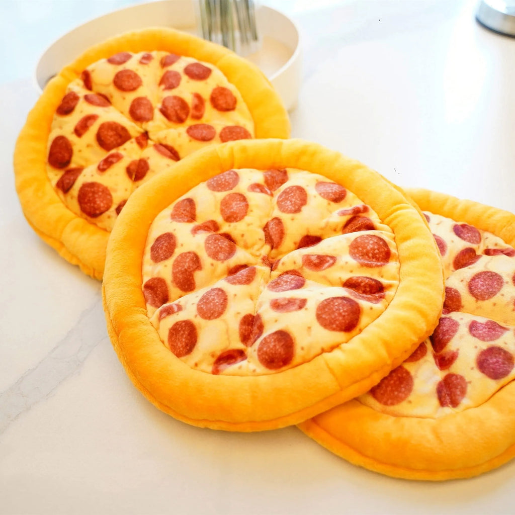 Yellow pizza design dog chewing toy with pepperoni and cheese details, 4 inches diameter