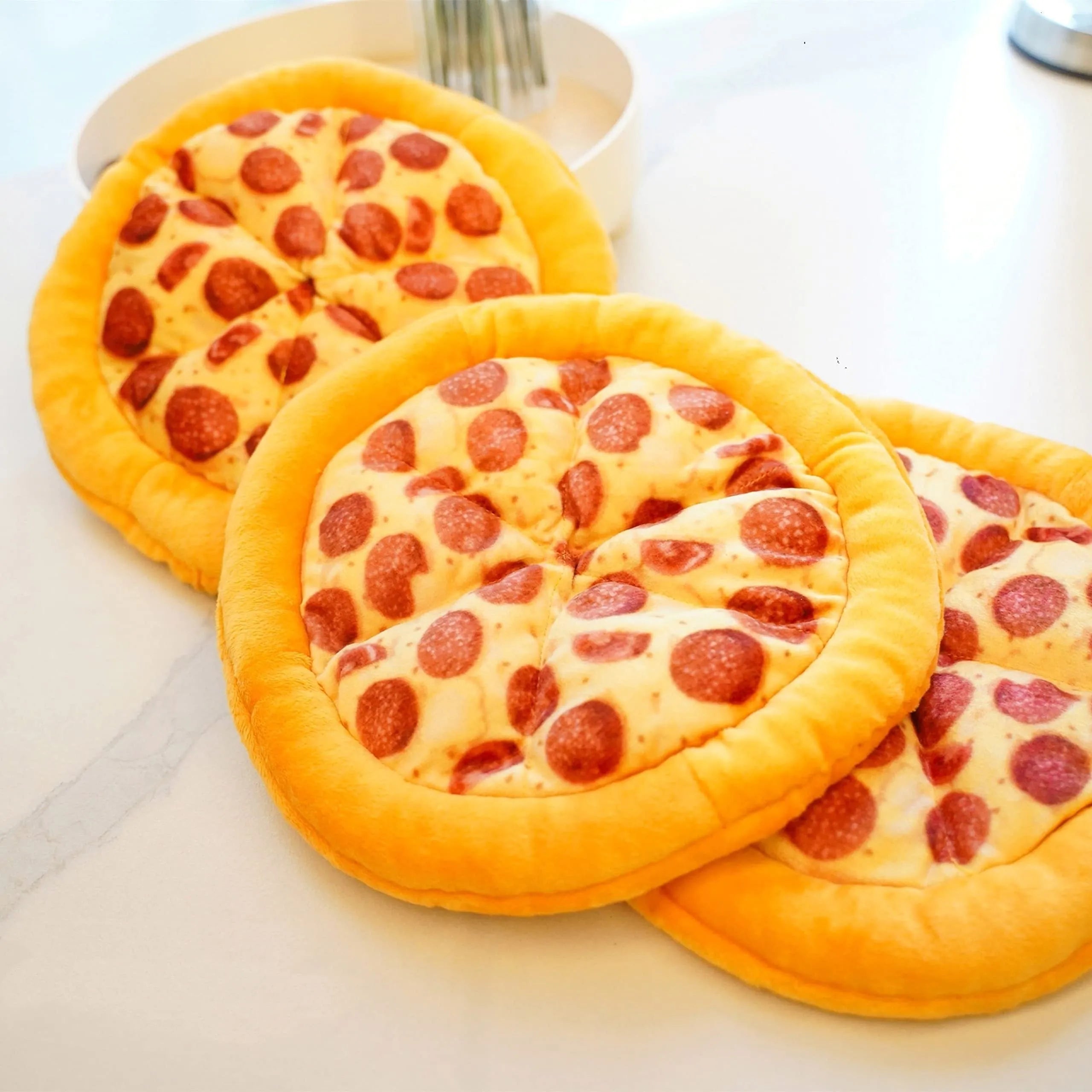 Yellow pizza design dog chewing toy with pepperoni and cheese details, 4 inches diameter