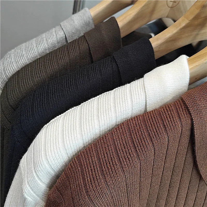 Man wearing a loose fit striped lapel pullover sweater in a rabbit fur and modal blend.