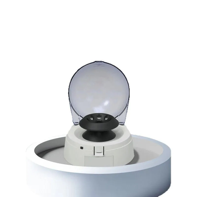 Small white laboratory mini centrifuge on a benchtop with dimensions 157mm wide by 170mm deep.