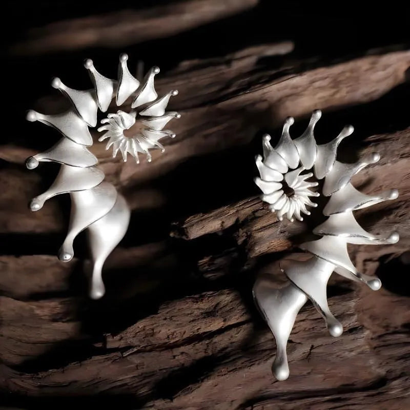 Exaggerated three-dimensional conch matte finish stud earrings with irregular shape