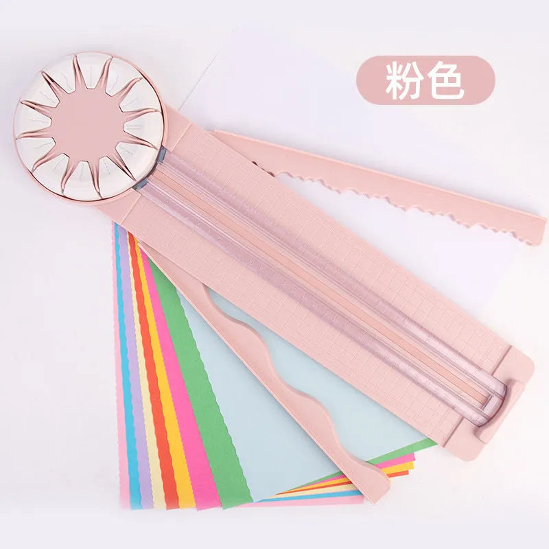 Pink and black plastic paper cutting machine with dotted guides and 12 cutting functions