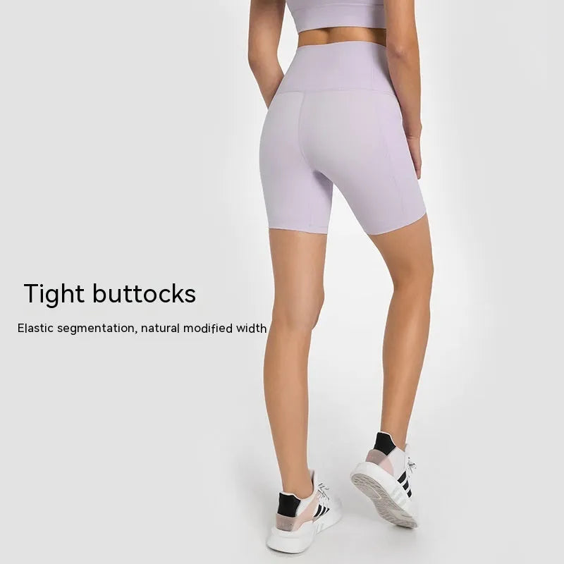 Women's tight black stretch sports shorts with cotton blend lining for running and fitness.
