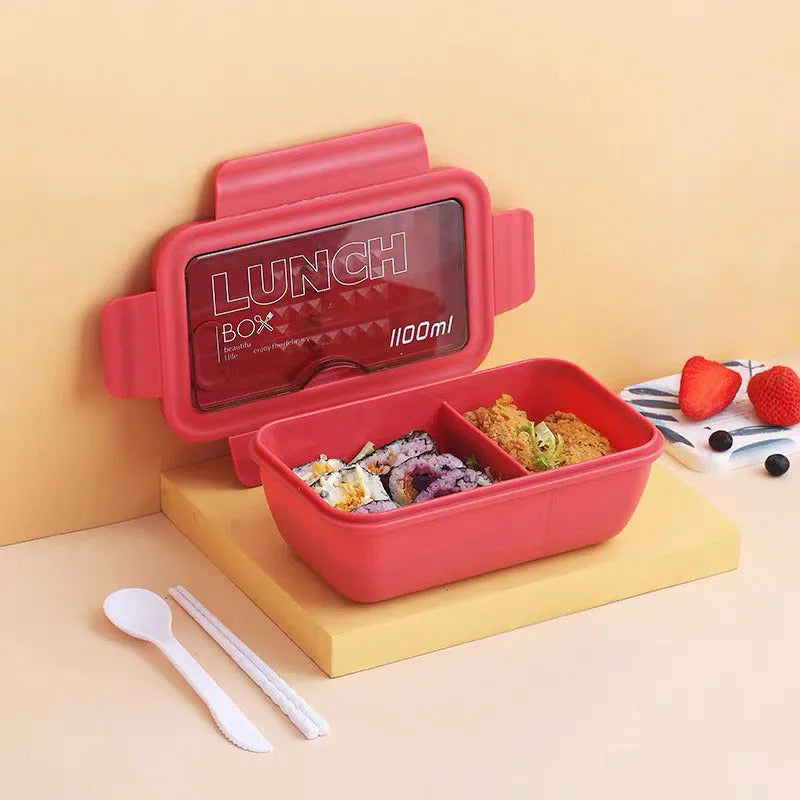 Green partitioned bento box with four compartments showing Japanese style and Nordic design