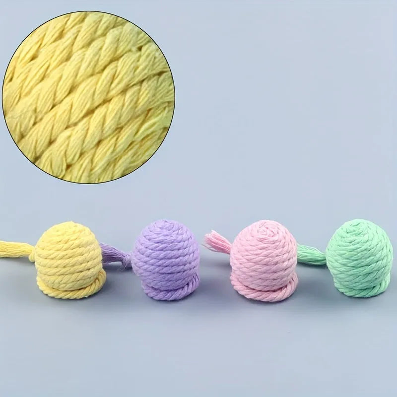 Colourful cat toy ball with an attached rope, shown in green, pink, purple, and yellow with 6cm and 3cm size options.