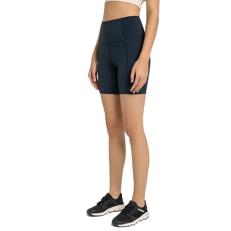 Women's tight black stretch sports shorts with cotton blend lining for running and fitness.