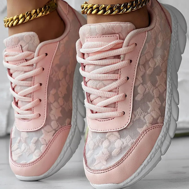Women's casual canvas running shoes in white, black, blue, or pink with a flat heel and rounded toe.