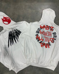 Black loose hooded sweatshirt with printed skull design and rhinestone accents