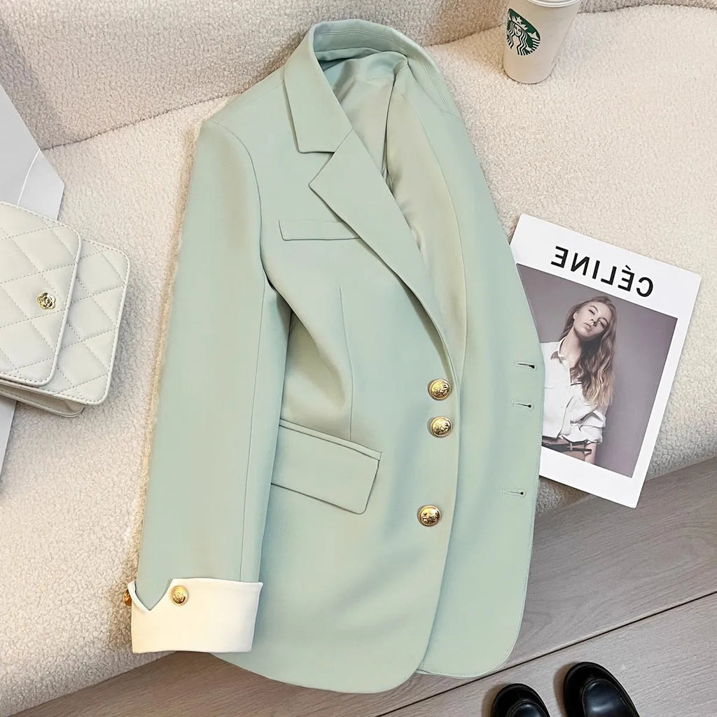 Korean style women's coat in loose fit with 65cm length and pockets in milky white colour