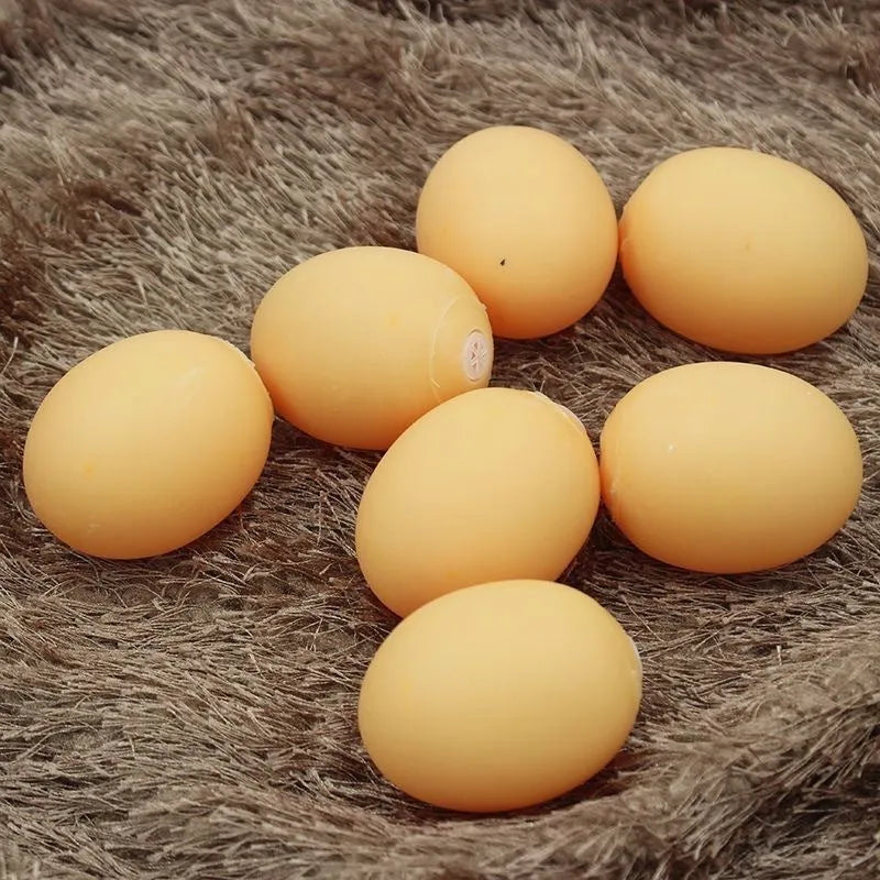 Simulation egg dog toy with sound in assorted colour, rounded plastic design for chewing and fetch play