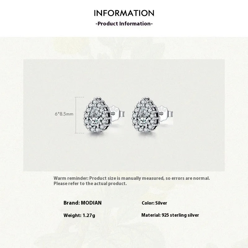 Silver drop-shaped ear studs with diamond-cut surface detail on 925 sterling silver