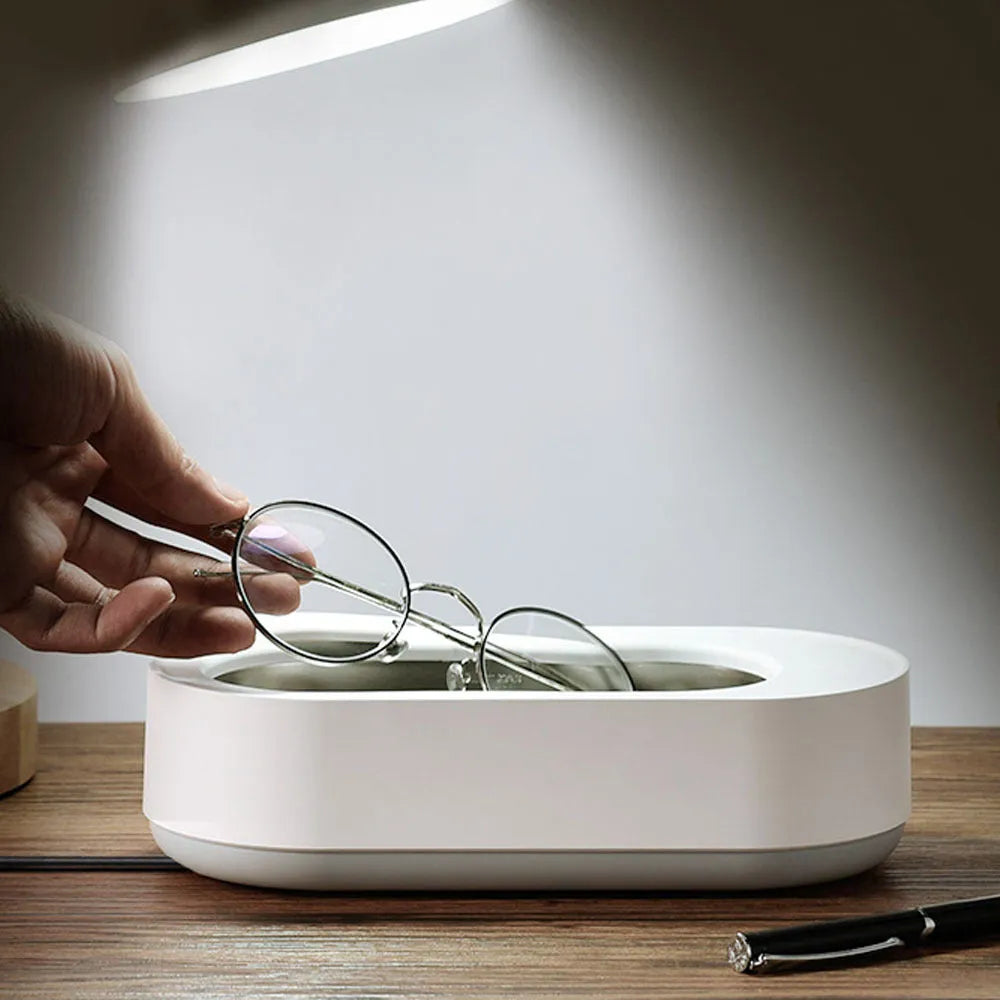White portable ultrasonic cleaning machine with touch button and stainless steel tank.
