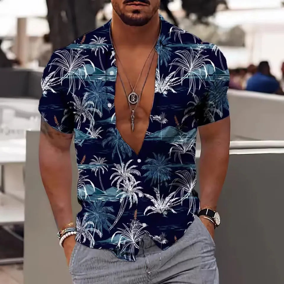 Man wearing a loose-fit short sleeve shirt with a colourful floral print pattern.