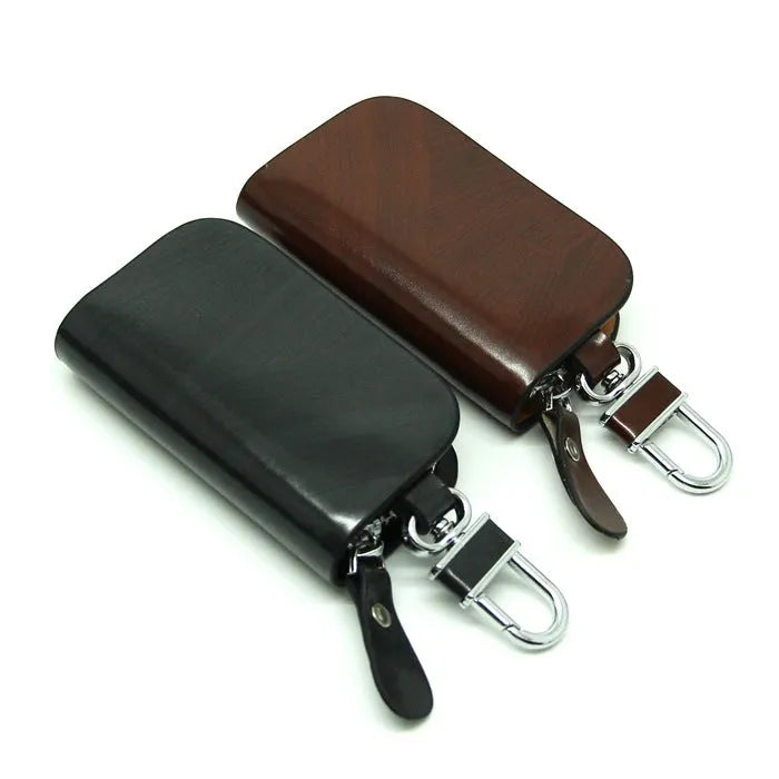 Genuine leather car key case with zipper in black and brown.