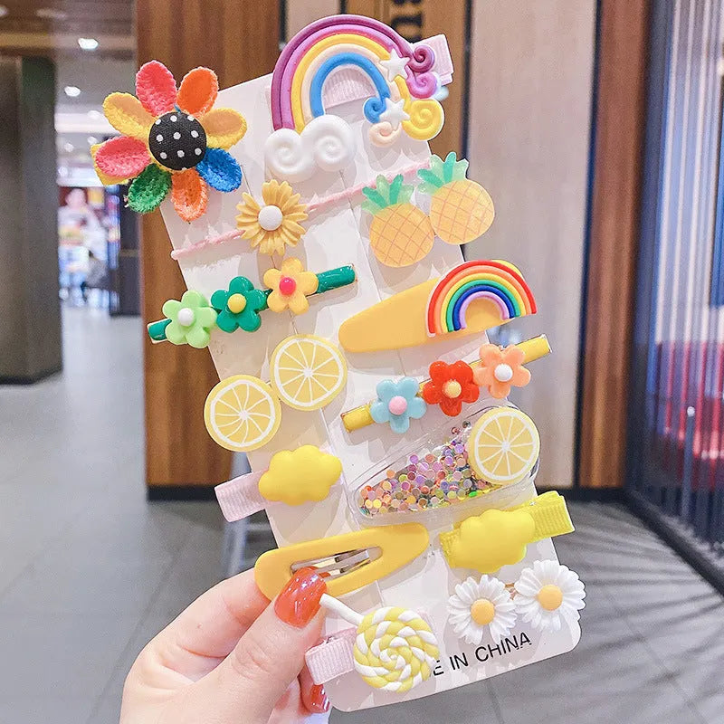 14-piece toddler hair accessories set: colourful rainbow, fruit, and butterfly barrettes in soft silicone clay.