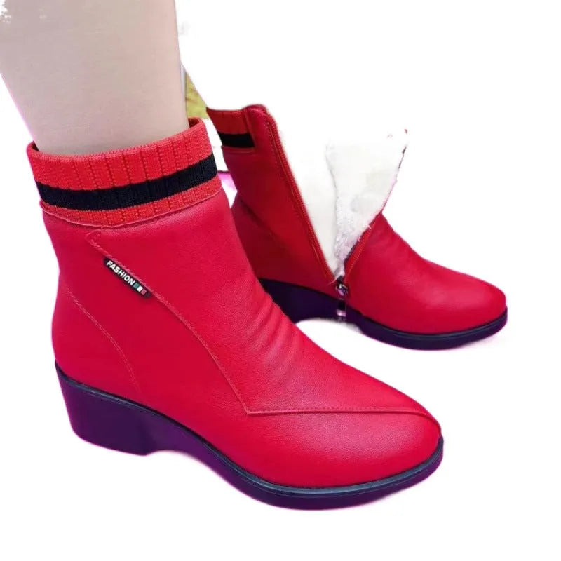 Women's soft leather ankle boots with mid heel, side zipper, and square heel in black