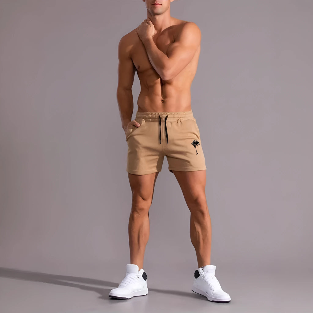 Men's casual khaki polyester sports shorts with coconut print on a model