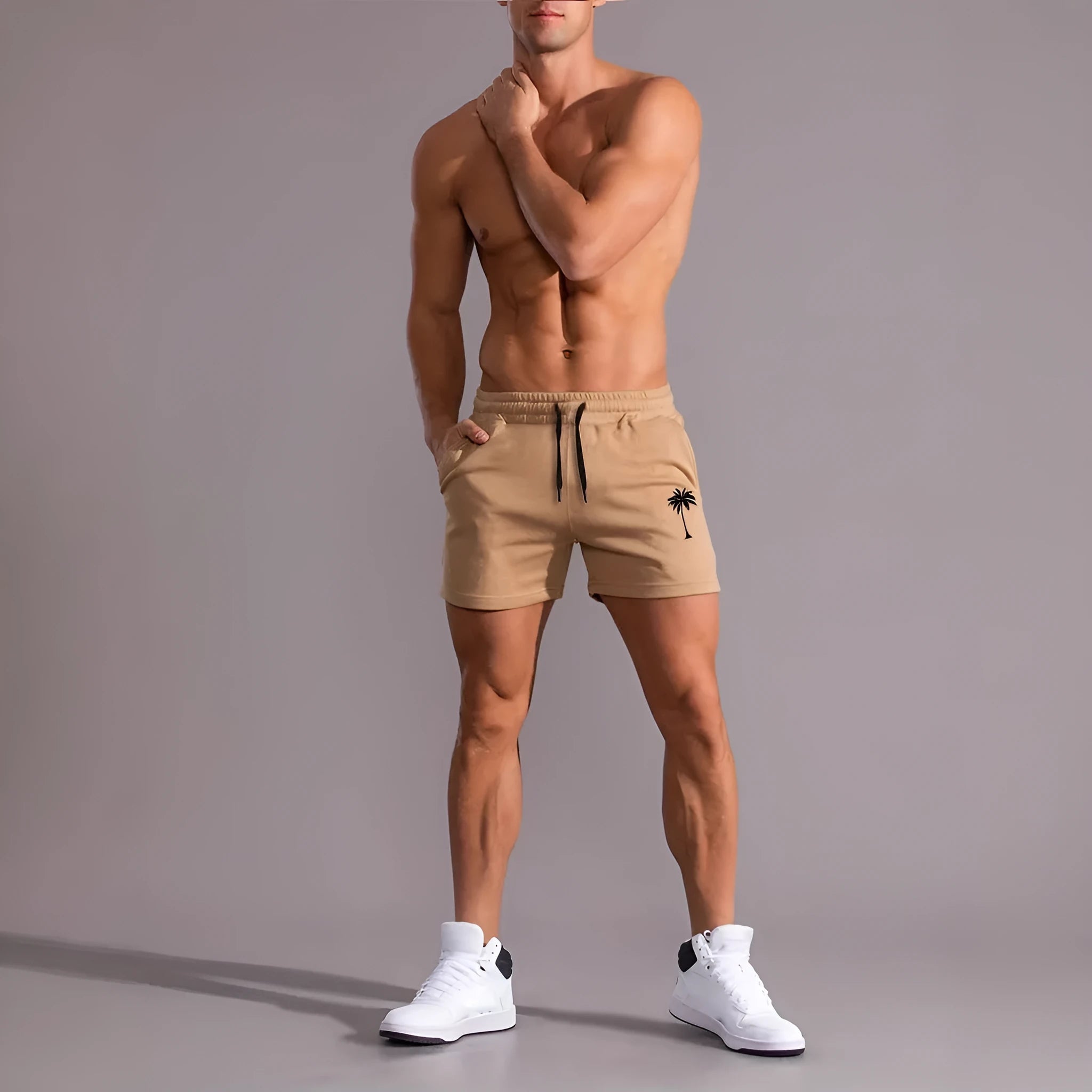 Men's casual khaki polyester sports shorts with coconut print on a model