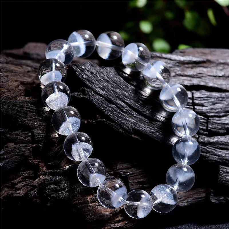 Natural white crystal ghost pyramid bracelet with Ruyi elements showing pyramid shapes and original design