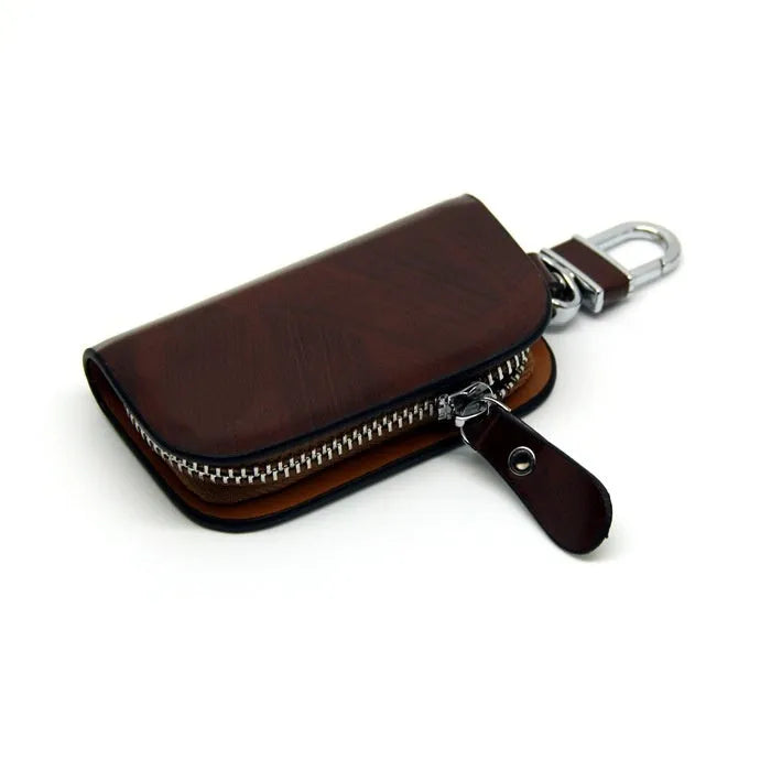 Genuine leather car key case with zipper in black and brown.