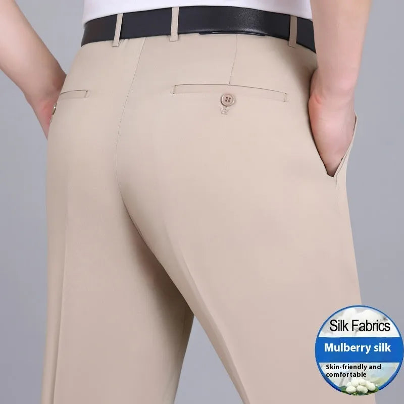 Man wearing dark blue straight-leg mulberry silk blend suit trousers with a high waist.