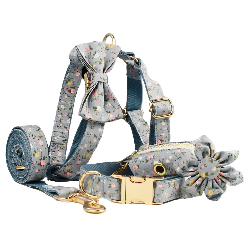 Blue floral polyester cotton dog collar set with matching leash, bow, vest, and poop bag accessories