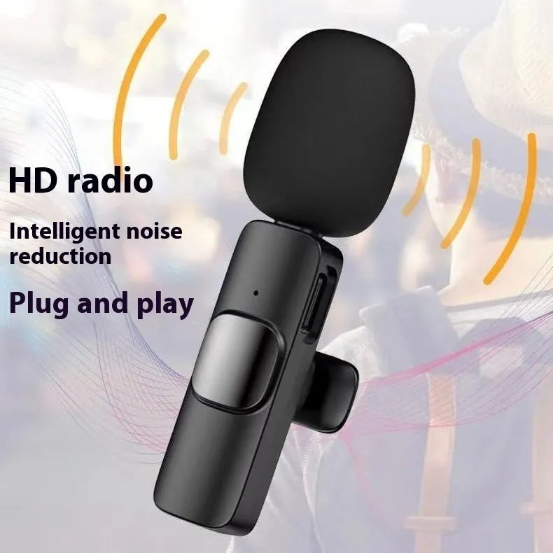 A wireless lavalier clip-on microphone attached to a shirt collar for hands-free video recording.