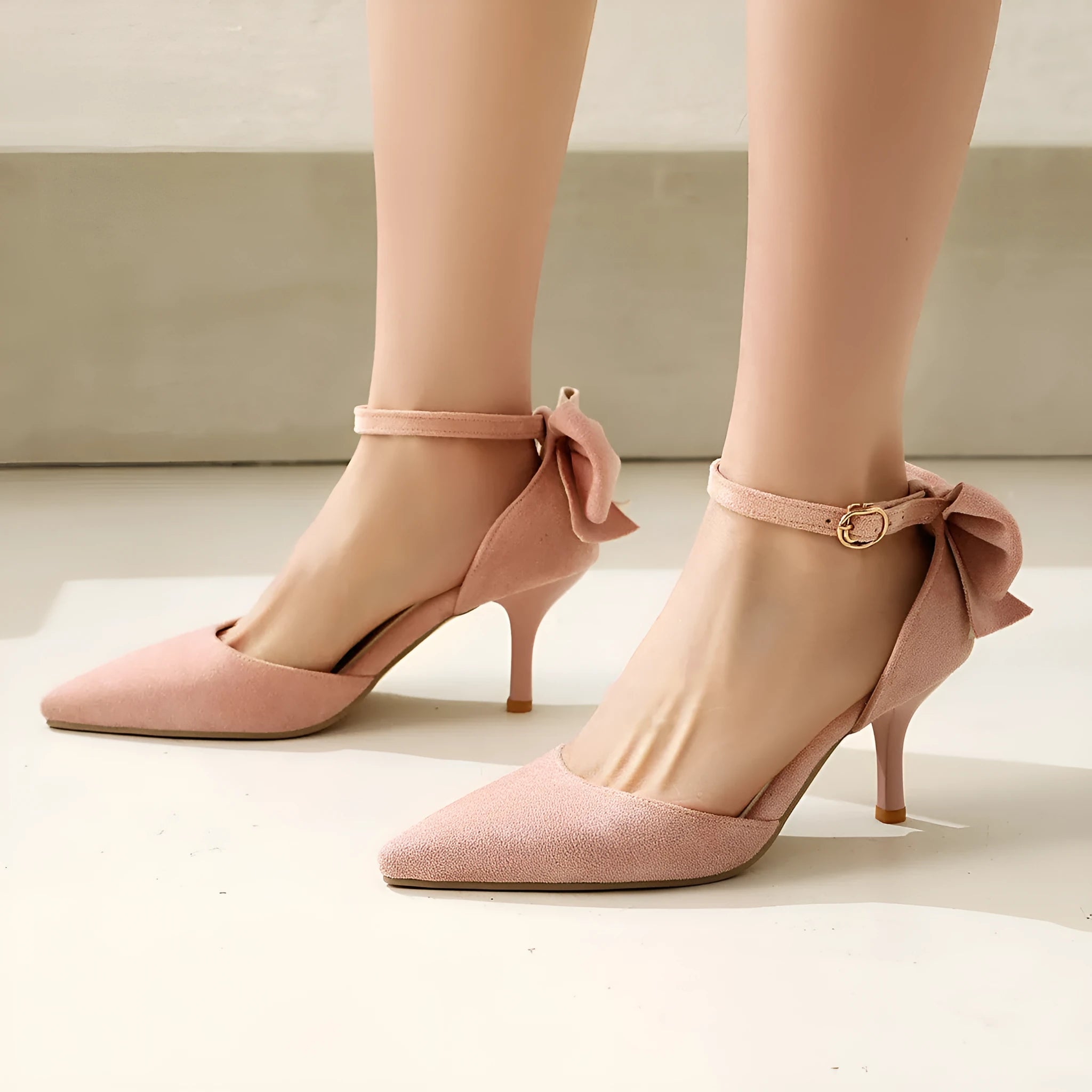 Suede pointed-toe stiletto high heels with bowknot and buckle closure