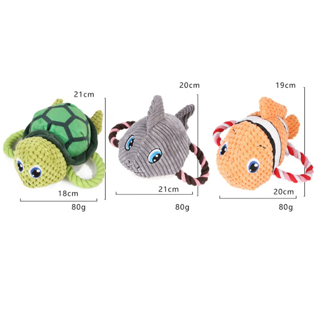 Grey, green, and orange turtle-shaped soft plush dog chew toy with internal knots.