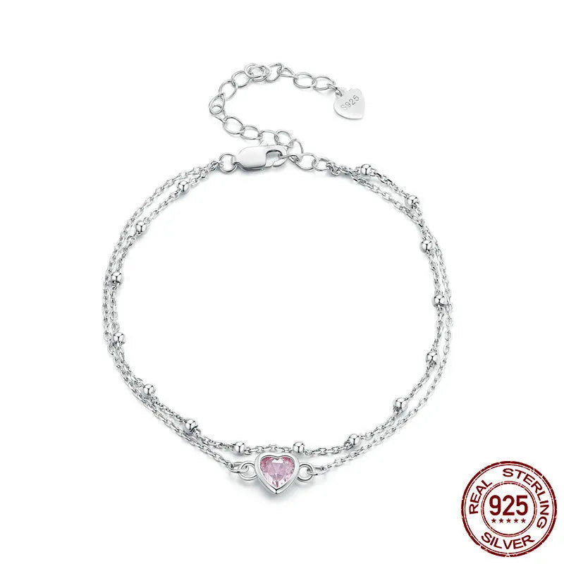 Sweet girlish sterling silver bracelet with a small heart-shaped pendant on an adjustable chain.