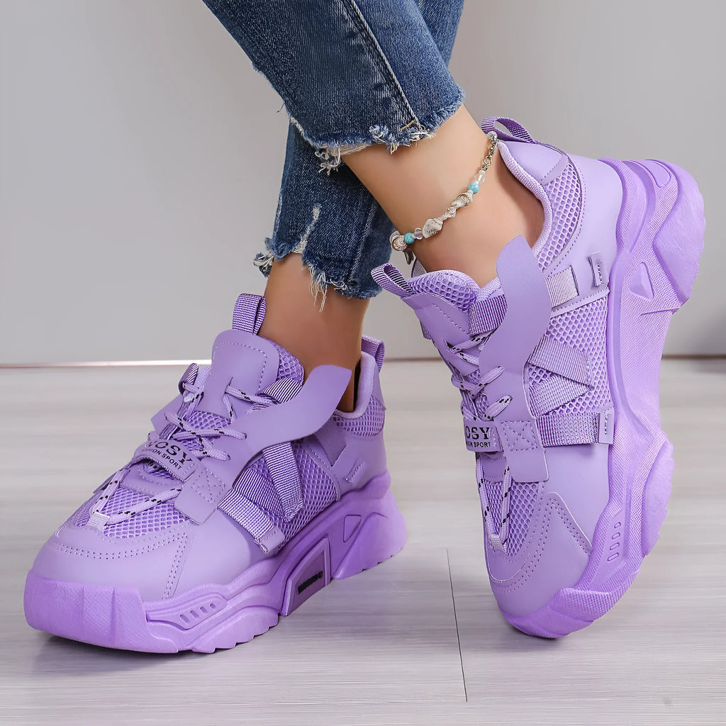 Women's platform sports sneakers in multiple colours with mesh upper and lace-up front.