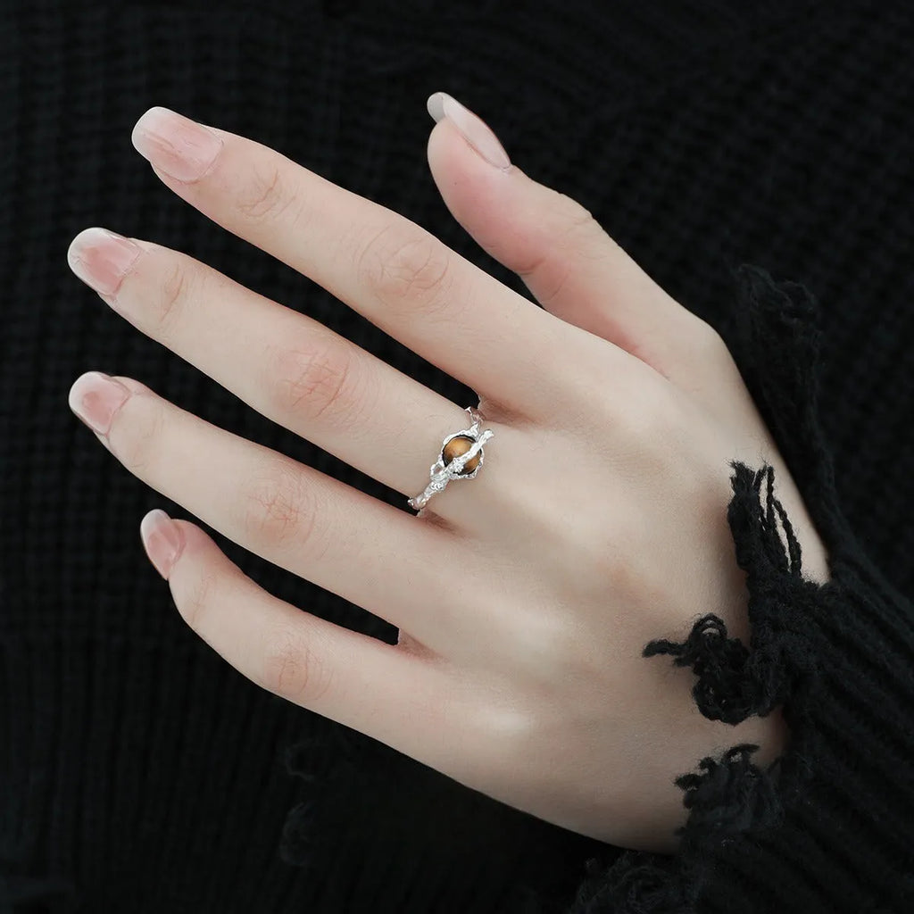 Women's Saturn design open ring with adjustable silver band and tigereye stone detail