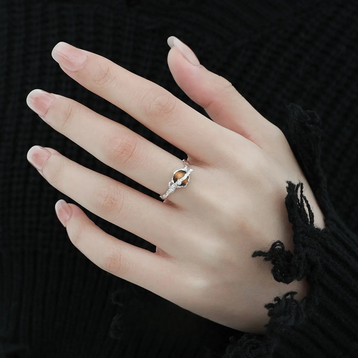 Women's Saturn design open ring with adjustable silver band and tigereye stone detail