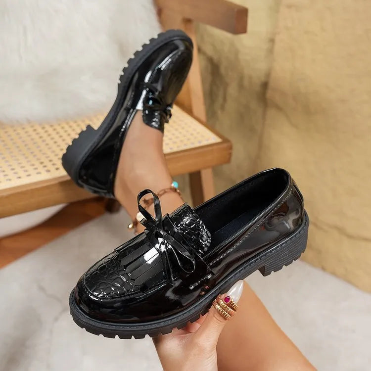 Women's black loafers with bow detail on artificial PU upper, flat sole design