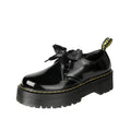 Women's thick-soled leather shoes with ribbon and cross strap details in lace-up design