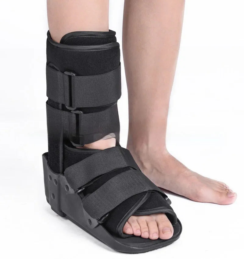Grey Achilles tendon rehabilitation walking boot with aluminium supports and nylon straps.