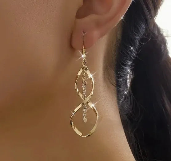 Gold electroplated alloy earrings with spiral geometric ellipse design for women