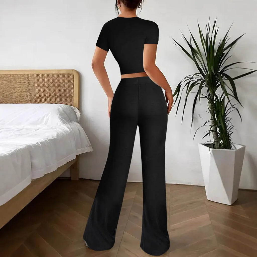 Black high waist trousers and short sleeve t-shirt co-ord set on hanger