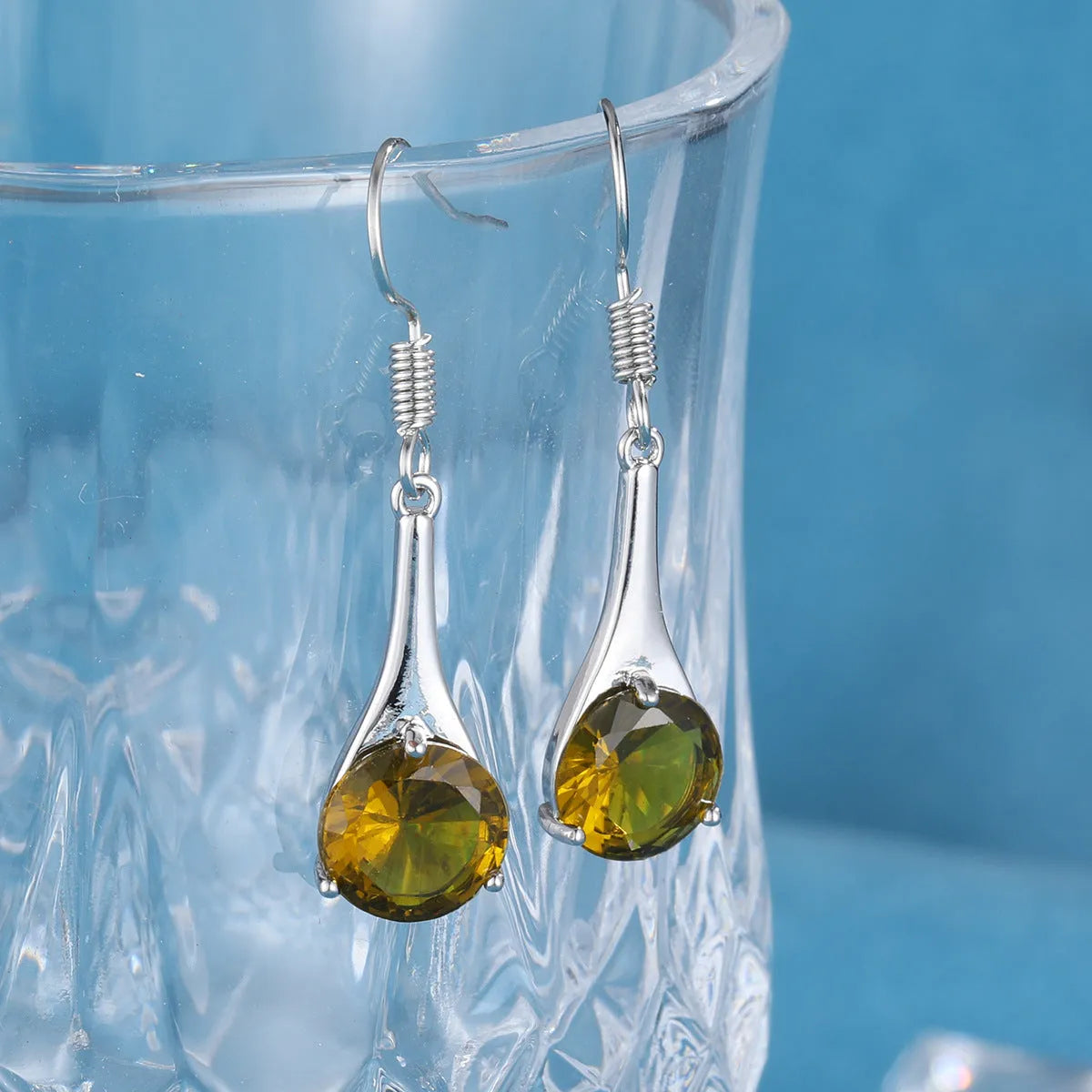 Olive green topaz drop earrings with water drop shape and retro style