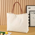 Cotton canvas tote bag with top handles and internal zip pocket in beige white colour option