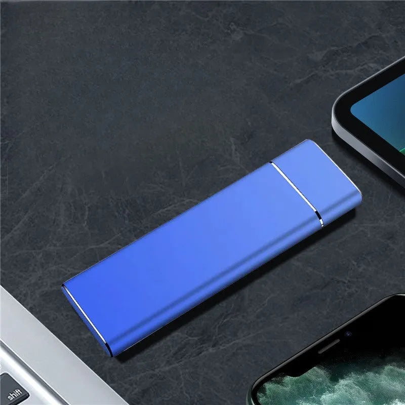 Sapphire Blue portable external hard drive with metal shell, shown next to its USB cable.