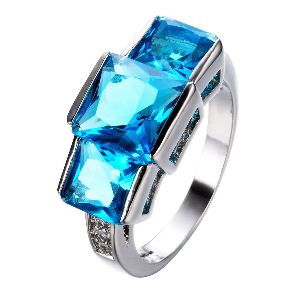 Wholesale geometric copper ring in multiple colours showing silver, gold, pink, blue, and green electroplated finishes.