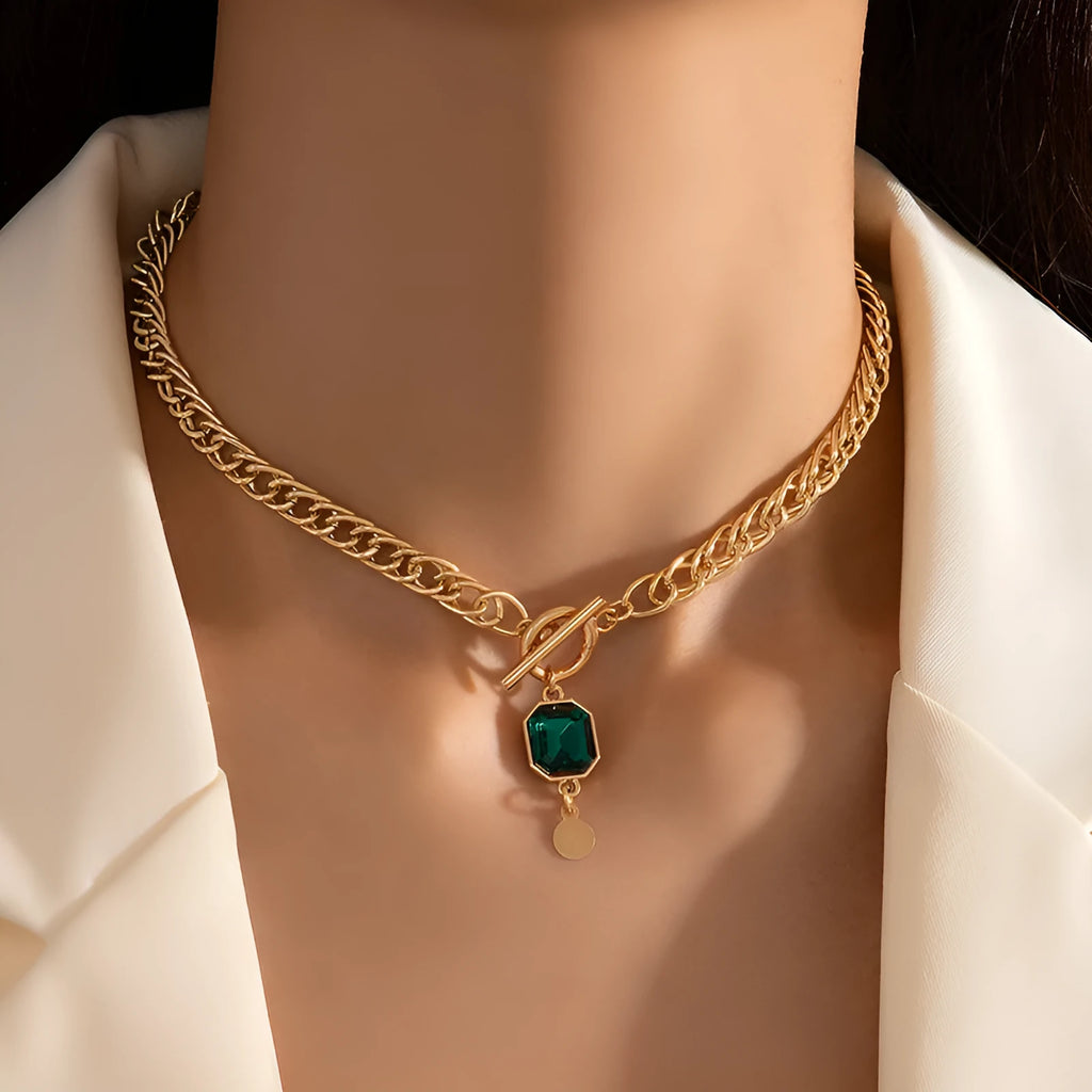 Gold electroplated titanium steel necklace with French retro geometric pendant and emerald zircon details